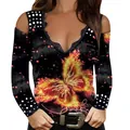 Detail view of the lace V-neck and fiery butterfly print on a black cold-shoulder top - 4XL / Tops / Butterfly - Gold