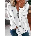 Close-up of white women's sweatshirt featuring grey star prints and front zipper detail - S / Tops / White