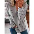 Gedetailleerde weergave van grijs sweatshirt met sterrenprint en rits aan de voorkant - Lichtgrijs