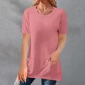 Detail view of pink loose fit women's T-shirt with round neck and side pockets - S / Tops / Pink