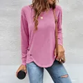 Casual pink long-sleeve t-shirt with irregular hem and decorative button details. - S / Tops / Pink