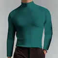 Close-up of men's slim fit emerald green turtleneck long sleeve base layer shirt - 3XL / Tops / Dark Green