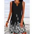 Close-up of sleeveless black dress with white floral print and keyhole neckline - S / Top And Bottom / Black