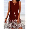 Detailed view of burgundy sleeveless summer dress with white floral print on a beach - S / Top And Bottom / Burgundy