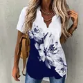 Elegante camisa con estampado floral con escote en V ondulado único y manga corta. - S / Tops / Azul Marino Flores Grandes