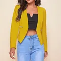 Detail view of mustard yellow cropped blazer with decorative zipper pockets. - S / Tops / Yellow