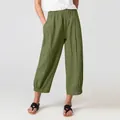 Close-up of women's loose casual pants in army green with elastic waist detail - Green