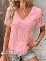 Close-up of pink floral lace fabric on women's V-neck short sleeve top - Pink