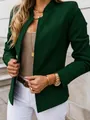 Close-up of a modern dark green collarless blazer for women with minimalist styling - Green