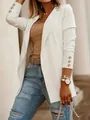 Detail view of a white long-sleeved blazer featuring decorative gold buttons on the cuffs - S / Tops / White