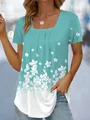 Detail shot of women's square neck floral print t-shirt featuring a teal gradient finish - S / Tops / Lake Blue