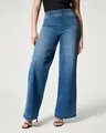 Full detail view of women's mid-rise wide-leg washed denim jeans featuring front seam design - XS / Bottoms / Navy Blue