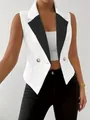 Close-up view of slim sleeveless white blazer vest with black contrast lapels and gold buttons - S / Tops / White