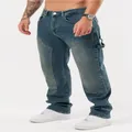 Men's stylish loose blue patchwork denim jeans shown in a full model fit lifestyle shot - XL=34 / Bottoms / Blue