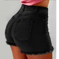 Back view of black high-waisted denim shorts with frayed fringe hems - S / Bottoms / Black