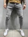 Detailed macro view showing the fit of men's slim-fit stretch skinny jeans in light gray - XL=34 / Bottoms / Gray