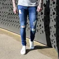 Stylish men's blue distressed skinny jeans featuring ripped knees and a vintage faded wash finish - S / Bottoms / Dark Blue