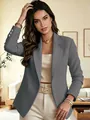 Detailed view of grey long-sleeved blazer with gold sleeve buttons and notched lapel. - Dark Gray