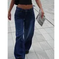Street style view of vintage low-rise wide-leg denim jeans in a dark blue wash. - XS / Bottoms / Dark Blue (331)