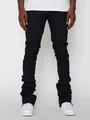 Close-up of black men's stacked denim pants featuring unique wrinkled leg design - S / Bottoms / Black