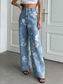 Close-up of retro blue floral print high-waisted straight leg wide-leg denim jeans - S / Bottoms / Blue