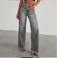 Women's gray washed wide-leg jeans with raw hem and loose fit for casual style. - S / Bottoms / Gray
