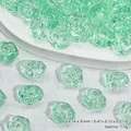 Close-up detail of light green translucent rose-shaped glass beads for jewelry - Rose Style (L592)
