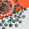 Detailed macro view of 14x14x8mm iridescent star-shaped glass beads for jewelry DIY projects - 14x14x8mm / Ink Blue (L678)