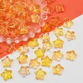Macro detail of orange star-shaped glass beads for DIY jewelry making, size 14x14x8mm - 14x14x8mm / Orange Yellow (L684)