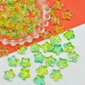 Detail view of colorful star-shaped lampwork glass beads for DIY jewelry crafts - 14x14x8mm / Green Yellow (L687)