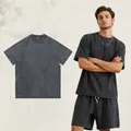 Vintage gewaschenes graues Baumwoll-T-Shirt mit lockerem Drop-Shoulder-Schnitt - S / Oberteile / Distressed Grau