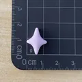 Mini purple four-pointed star resin accessory shown with a cm measurement ruler - Purple
