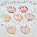 Macro view of Ruyi cloud glass beads in pink and gold gradient for handmade jewelry DIY - Liuli Auspicious Cloud (L570) / Yellow Pink