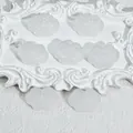Close-up detail of small RuYi cloud shaped glass pendants for DIY jewelry making - Liuli Auspicious Cloud (L576) / White