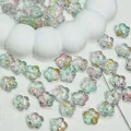 Detail view of gradient cherry blossom glass beads with gold foil for DIY jewelry - Cherry Blossom / 12mm / Pink & Green