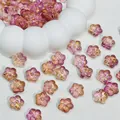 Close-up detail of gradient purple and pink Sakura flower glass beads for DIY jewelry making - Purple Gold
