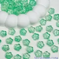 Macro view of translucent green cherry blossom glass beads for DIY jewelry accessories - Light Green