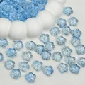 Close-up of translucent light blue cherry blossom glass beads for DIY jewelry making. - Light Blue