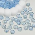 Close-up of translucent light blue cherry blossom glass beads for DIY jewelry making. - Light Blue