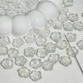 Detail macro view of transparent glass cherry blossom beads for handmade DIY jewelry crafting - Cherry Blossom / 12mm / Iridescent White