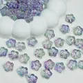 Macro shot of transparent gradient glass cherry blossom beads, measuring 12x12x7mm - Purple Multi