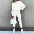 Detail showing women's white high-neck sweatshirt and matching joggers set on model - S / Top And Bottom / Off White