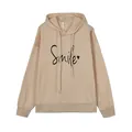 Vista detallada de la sudadera beige con capucha y estampado Smile negro con un corazón - S / Tops / Albaricoque