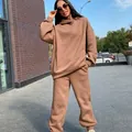 Woman in oversized camel brown hooded sweatshirt and sweatpants casual tracksuit set - Camel