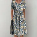 Detailed view of women's short sleeve floral print dress with elegant pleated large hem - S / Bottoms / Color 4 (Dark Blue Floral)