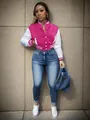 Detail view of pink and white varsity jacket with striped cuffs and snap buttons. - S / Tops / Rose Red
