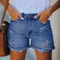 Close-up view of distressed denim shorts with high-waisted fit and stylish cuffed hems. - S / Bottoms / Dark Blue