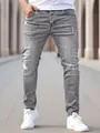 Close-up detail of men's slim-fit distressed grey denim jeans with comfortable stretch fabric - S (28) / Bottoms / Gray