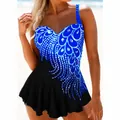 Detail view of plus size swim dress with blue peacock tail pattern and ruffled hem. - M / Top And Bottom / Blue