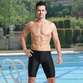 Professional black men's sharkskin jammers shown at an outdoor swimming pool setting - L / Bottoms / Navy Blue